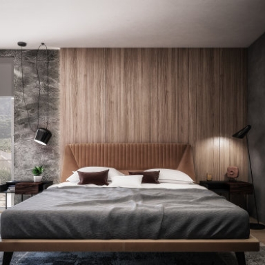 Doppelbett vor einer holzverkleideten Wand